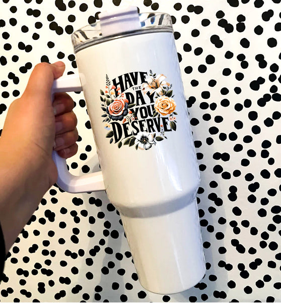 black test that says have the day you serve with flowers on a white insulated tumbler with a handle