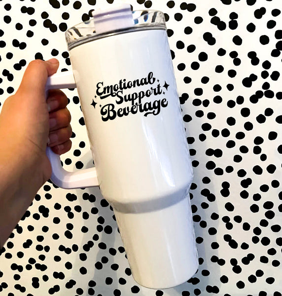 black script font that says emotional support beverage on a white insulated 40oz tumbler with a handle