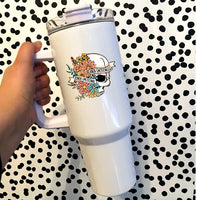 text that says kinda emotional kinda emotionless with a flowers and a skull on a white insulated 40oz tumbler with a handle