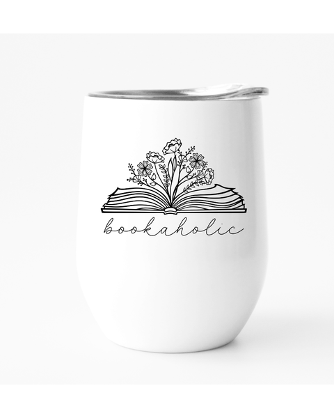 White tumbler with 'bookaholic' design featuring an open book and flowers on a white background