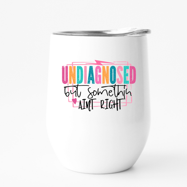 font that says undiagnosed but something ain't right on a wine tumbler